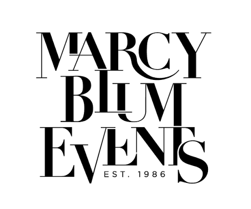 Logo for Marcy Blum Events featuring black text with stylish serif fonts, including the words 'Marcy Blum Events' and 'Est. 1986'.