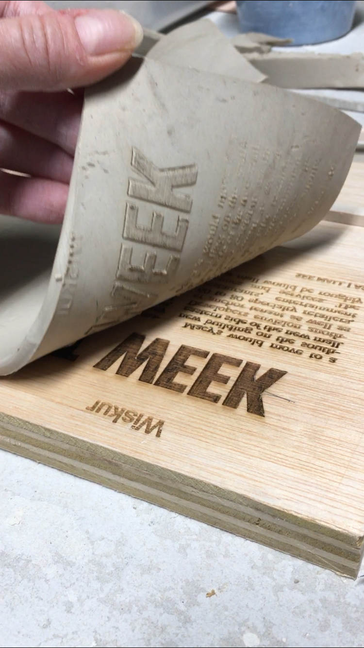 First test! October 2021. Pressing clay slab into laser engraved plywood.   