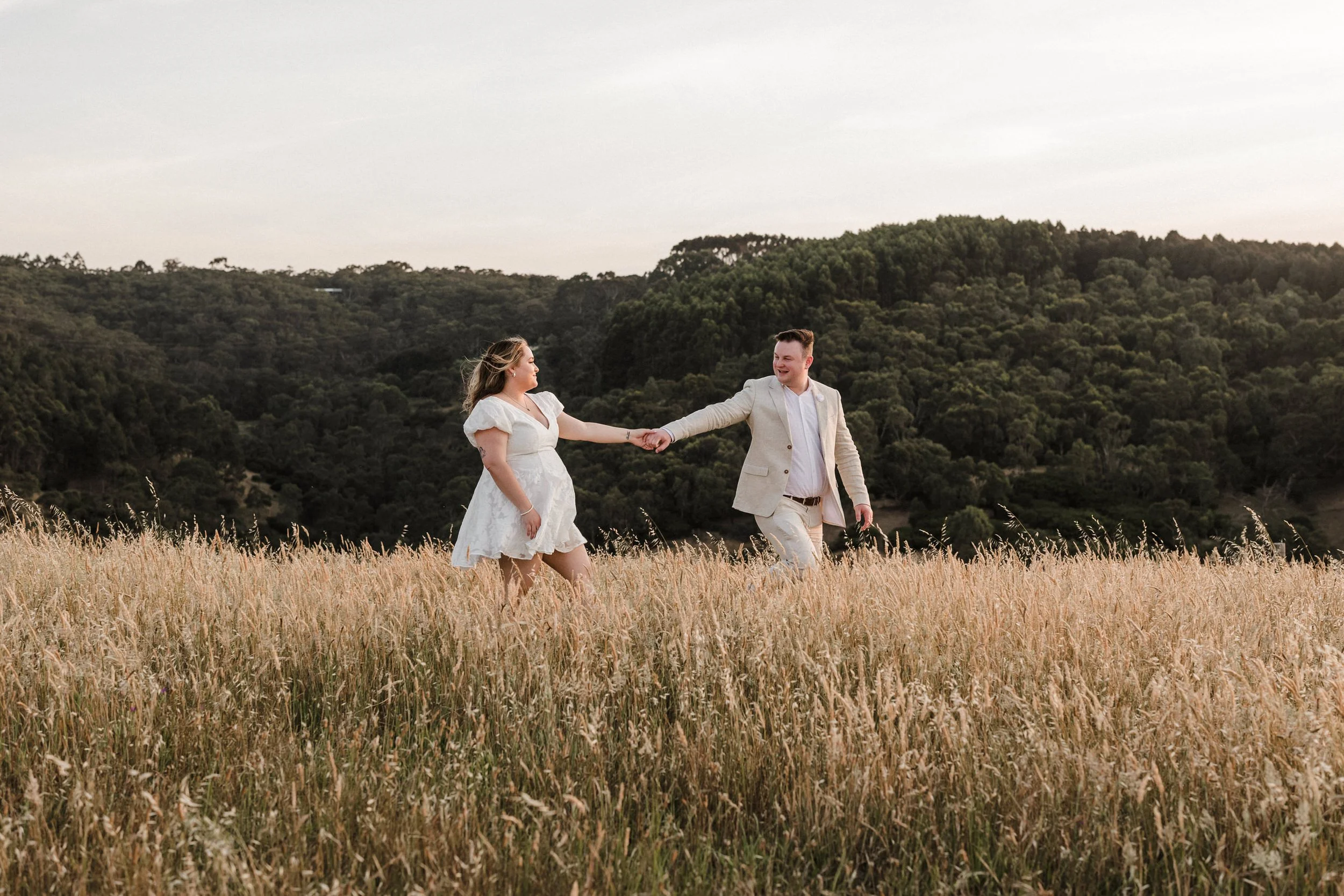 Magnolia Farm Elopement 054 sunset portrait of couple walking through a rustic field.jpg