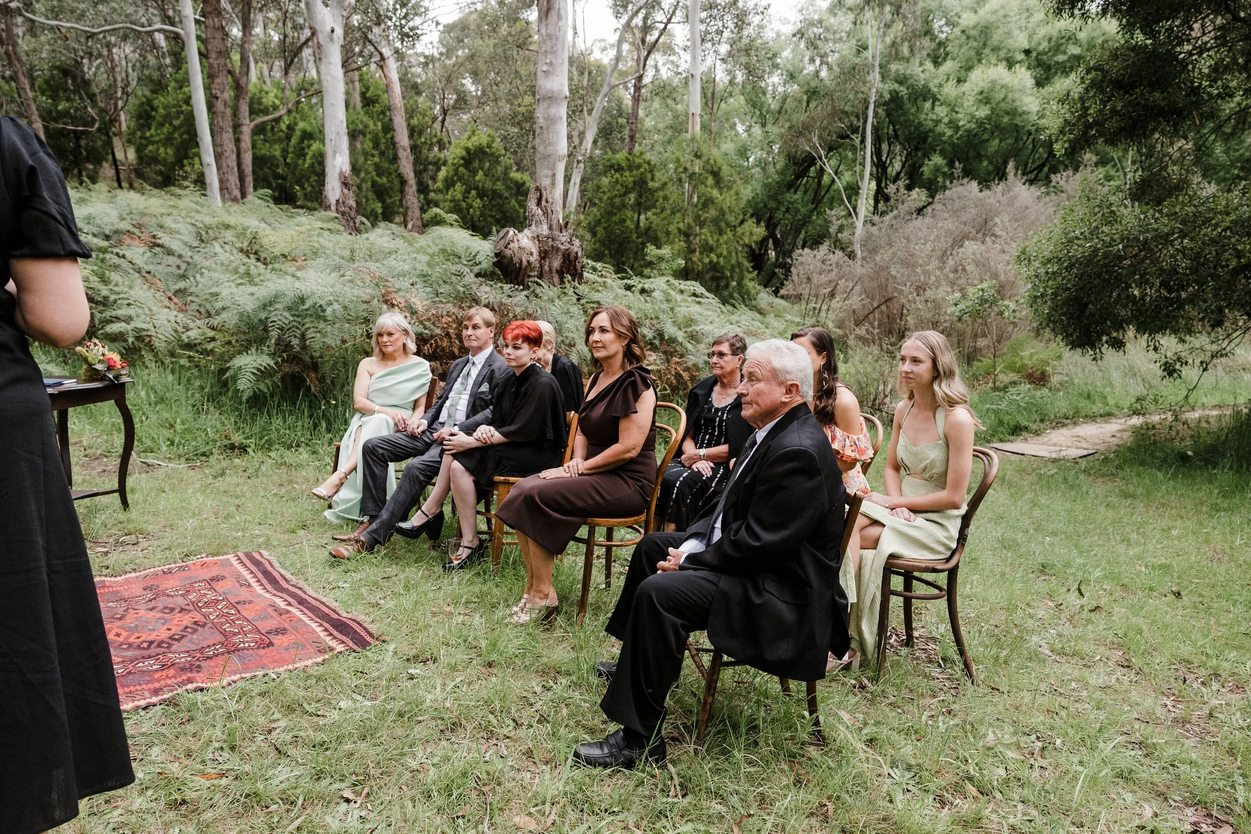 Intimate Forest Wedding - Sinclairs Gully Winery 16 - guests watching ceremony.jpg