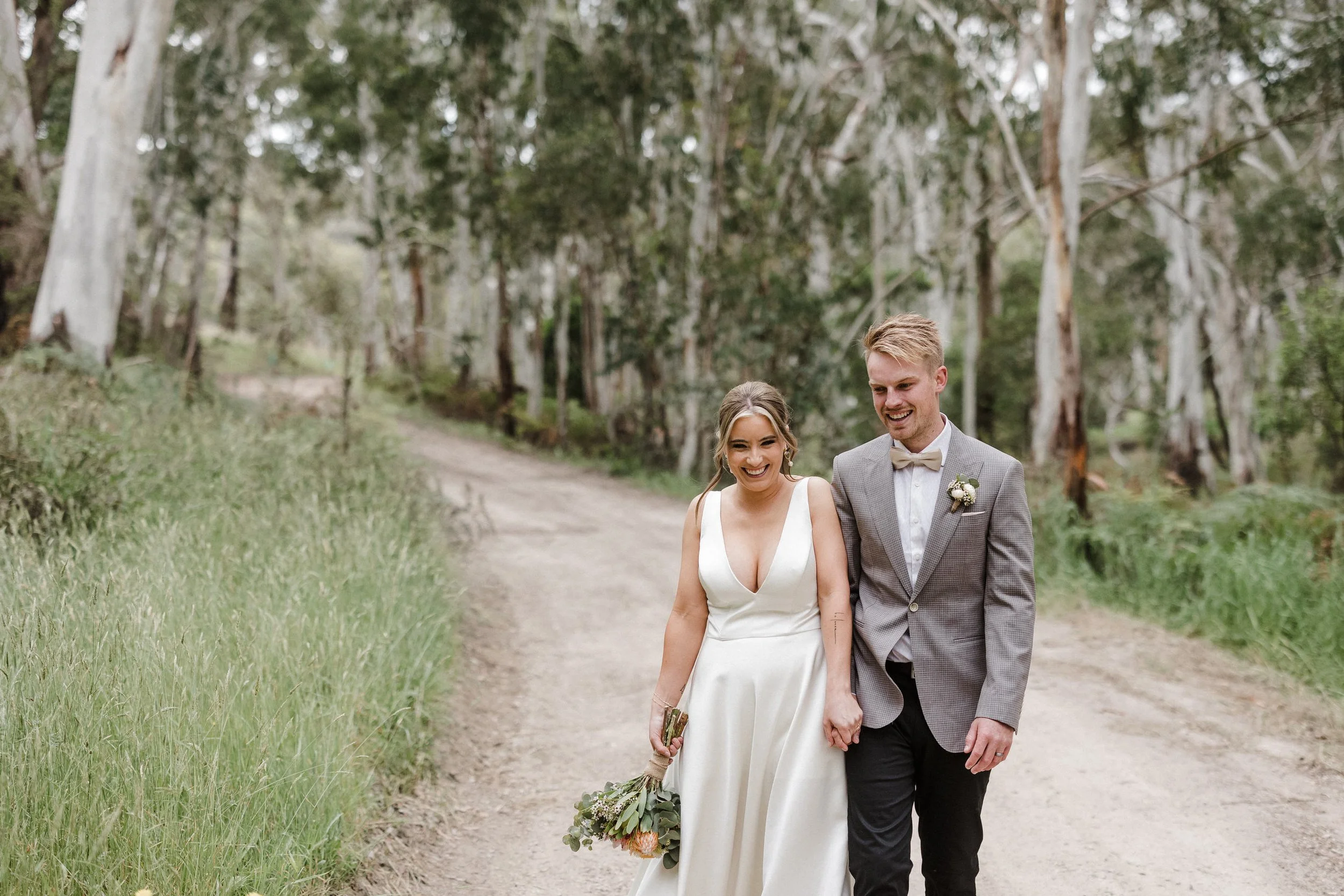 Intimate Forest Wedding - Sinclairs Gully Winery 42 - couple portraits on dirt road.jpg