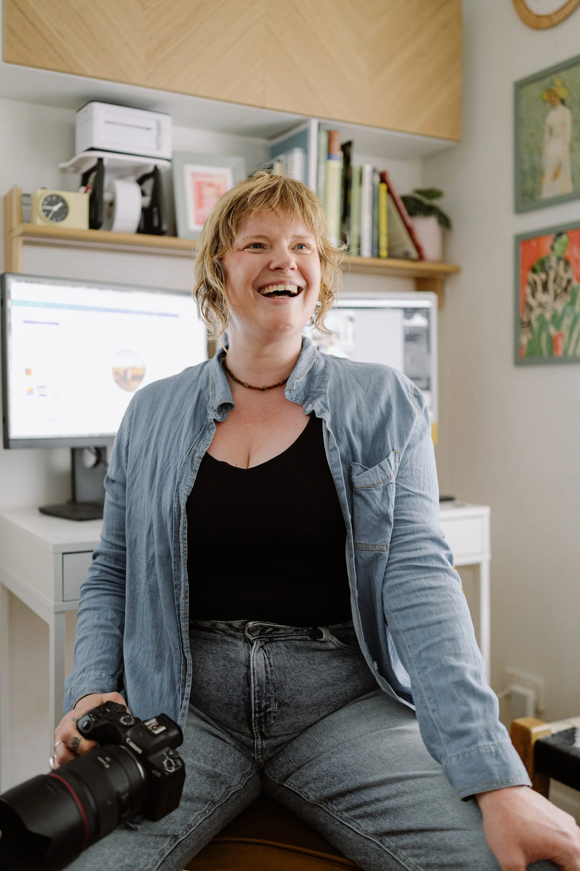 a portrait of Adelaide wedding photographer Sarah Graue, laughing and looking off camera
