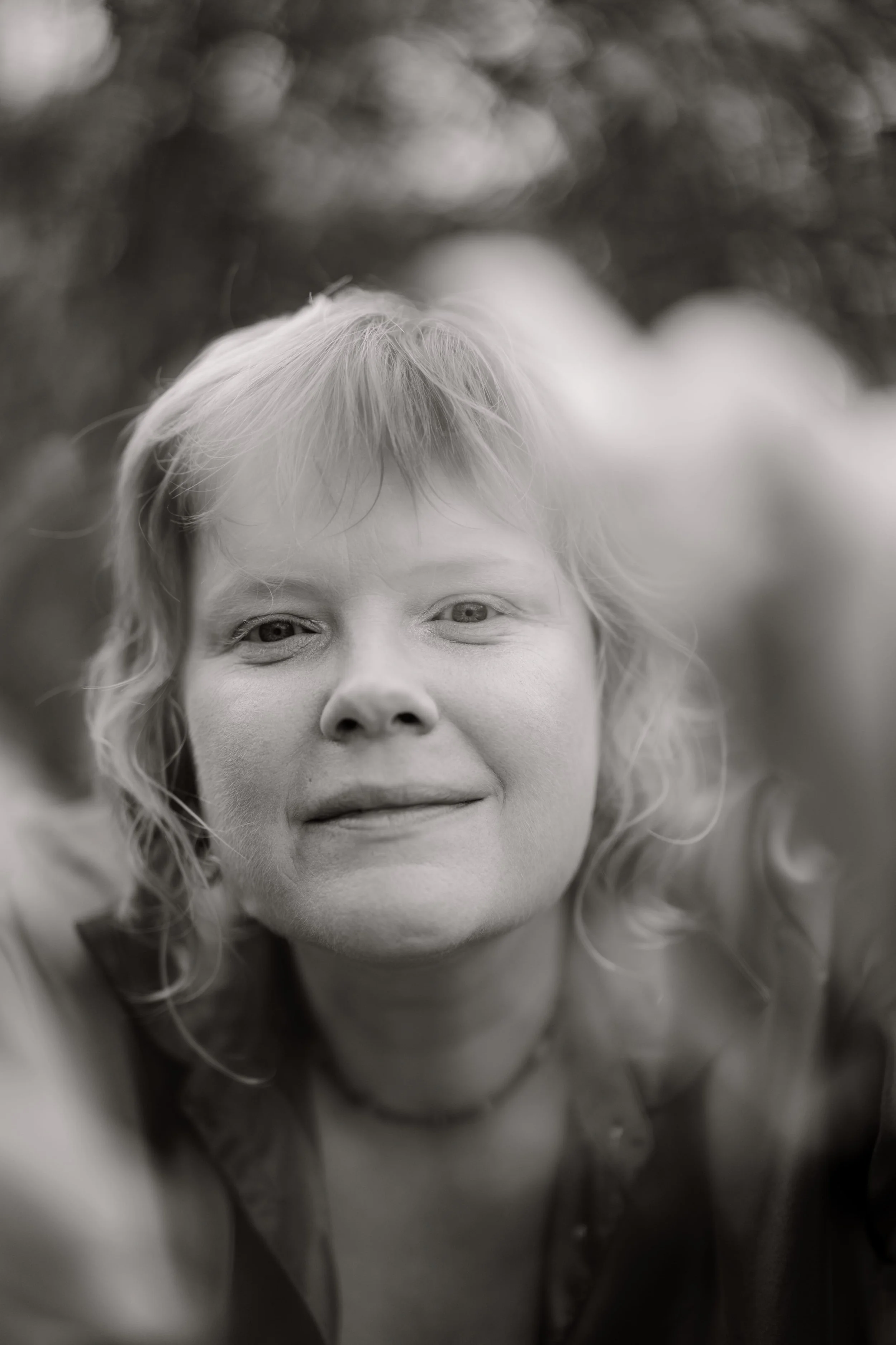 Adelaide wedding photographer Sarah Graue of Little Car Photography smiling at the camera in black & white