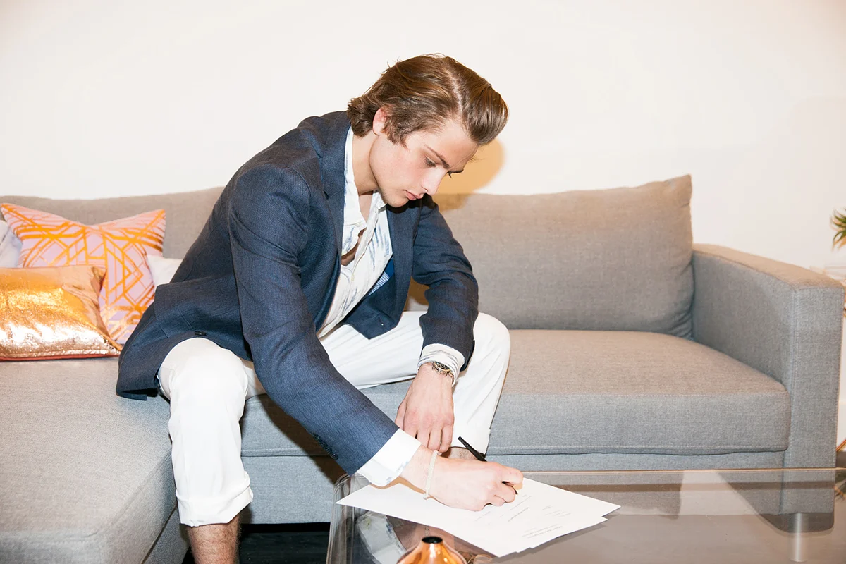 Trevor Cole signing his first major modeling contract.