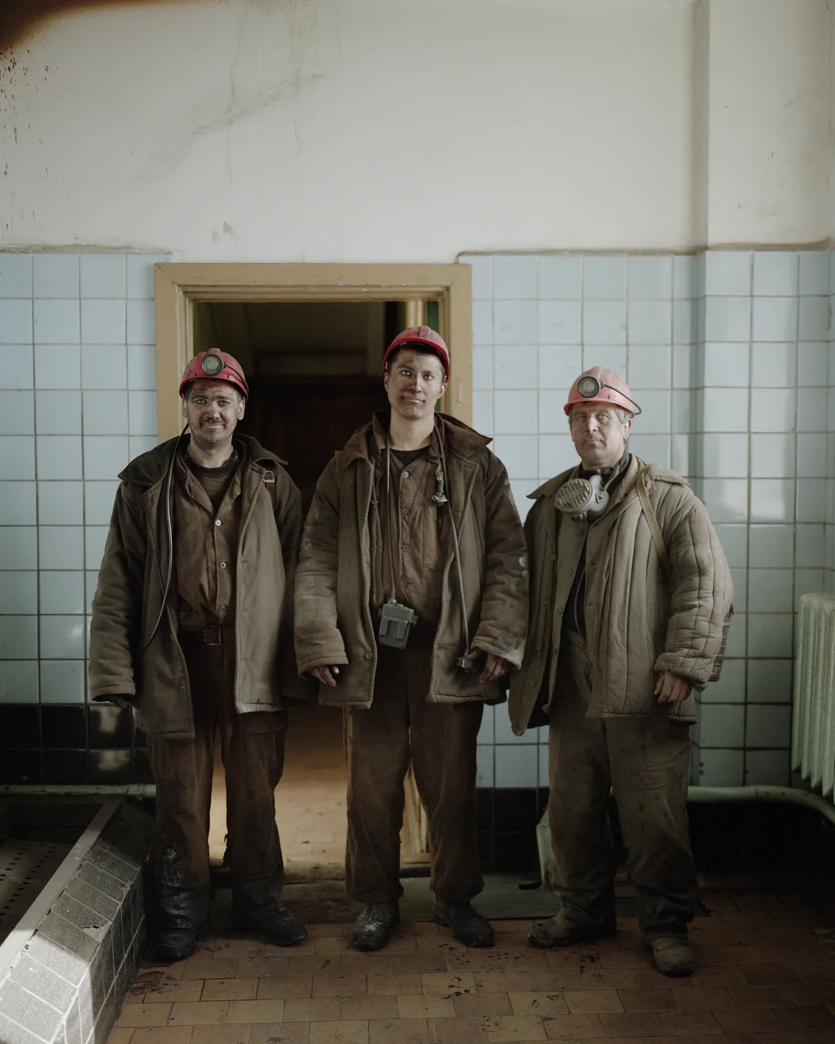     After eight hours in the dark mine shaft in Barentsburg, the Ukrainan workers Alexander, Gennadiy and Seku are finished at their work place located 500 meters below sea level. The work is very dangerous. Since 1989 forty workers have lost their l