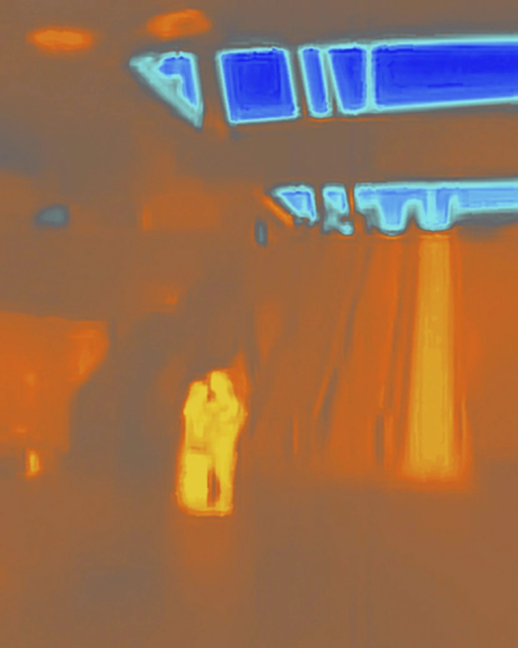   A young couple is kissing.  