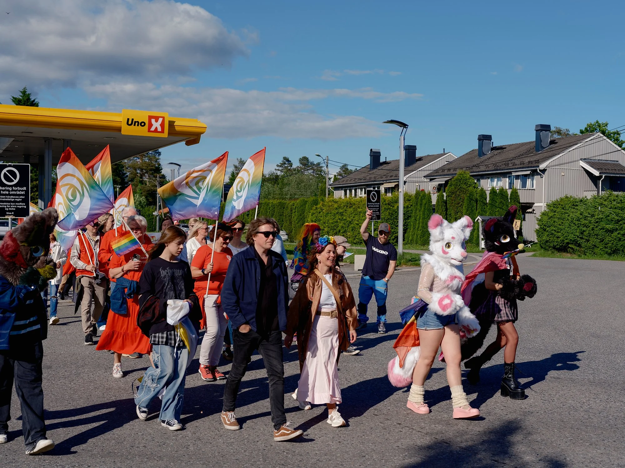   The Pride parade passes the Uno-X petrol station in Jessheim, June 2026.  