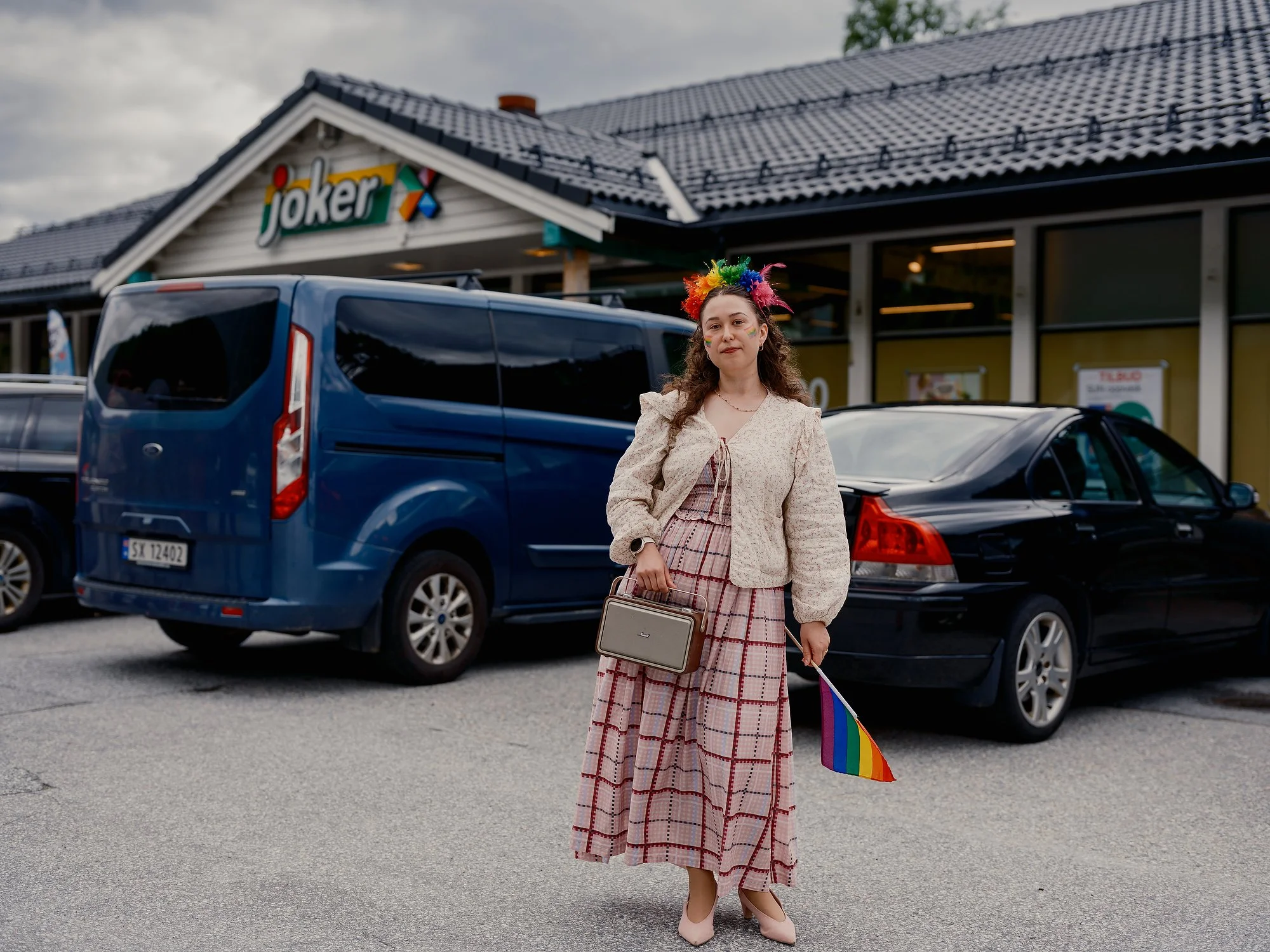   Anna, 36, outside the local supermarket at Kyrkjebø before the Pride parade, June 2026.  