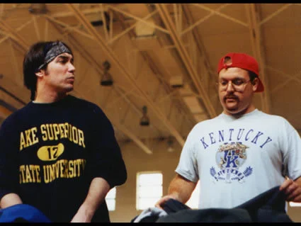 Best friends discuss important issues over a game of basketball.