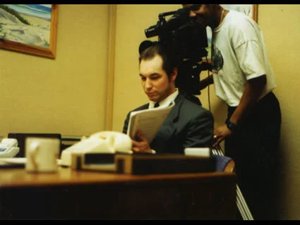Lead actor, Matt Southwell, goes over his script as Director, David Evans, sets up his next shot.