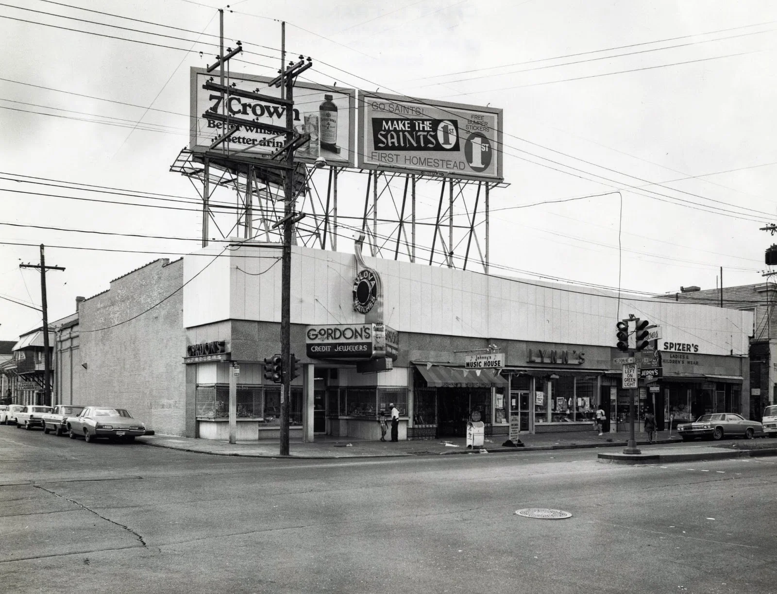 In later years the street-spanning arcade was removed and the building was divided into multiple storefronts. The renovation process returned the space to the original blueprint and maintained authentic details. 