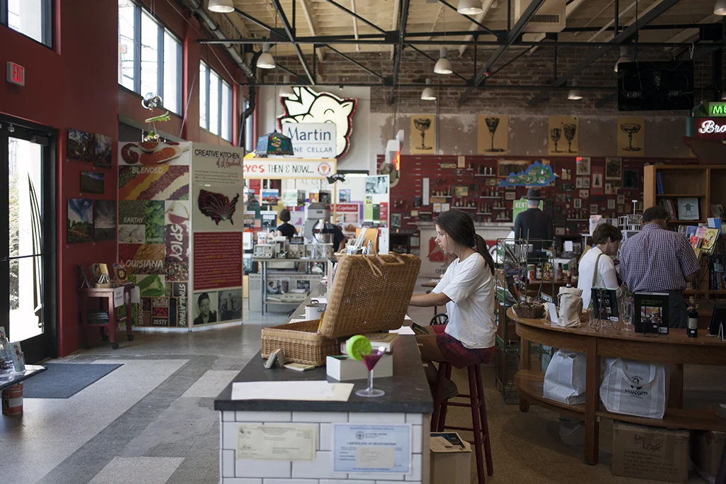 Entering the museum, visitors check in at a subway tile and soapstone admissions desk and take in the building's expansive market architecture.
