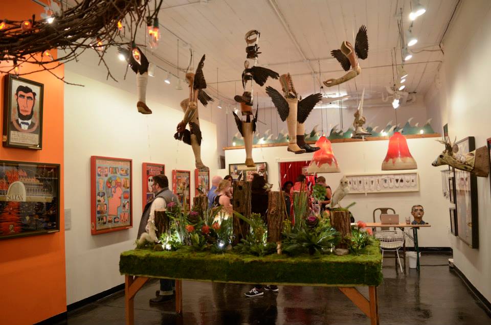 and a central installation evoking the concept of a phantom limb with suspended prosthesis and natural forest-scape.