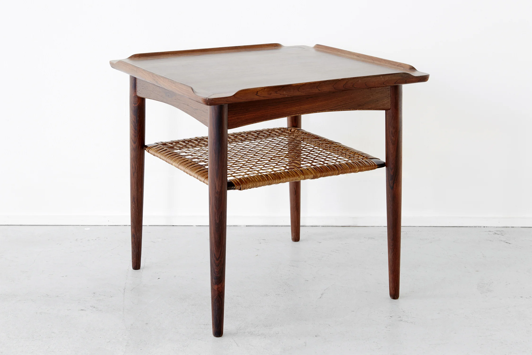ROSEWOOD + CANE SIDE TABLE BY POUL JENSEN