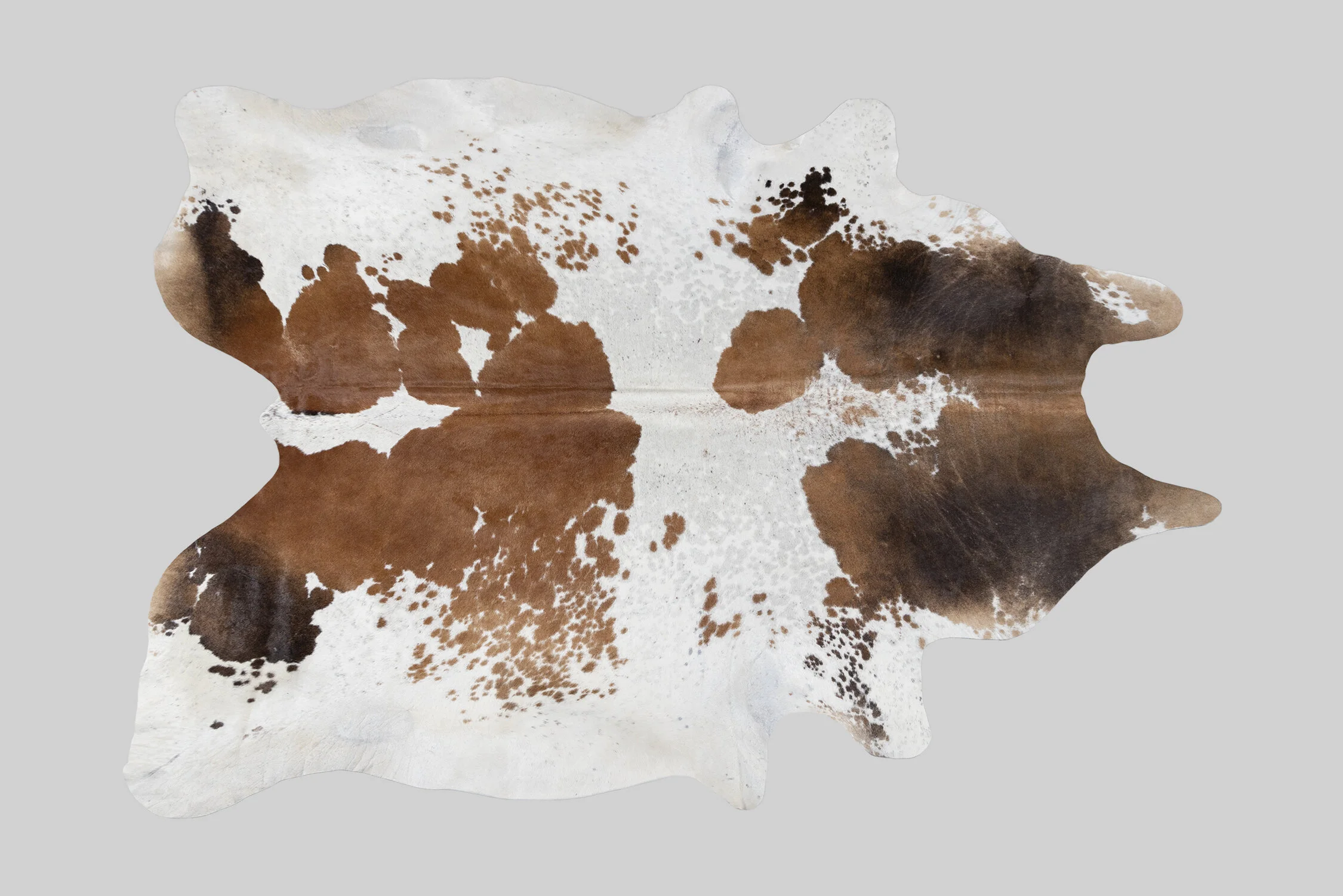 SPOTTED GENUINE BRAZILIAN COWHIDE