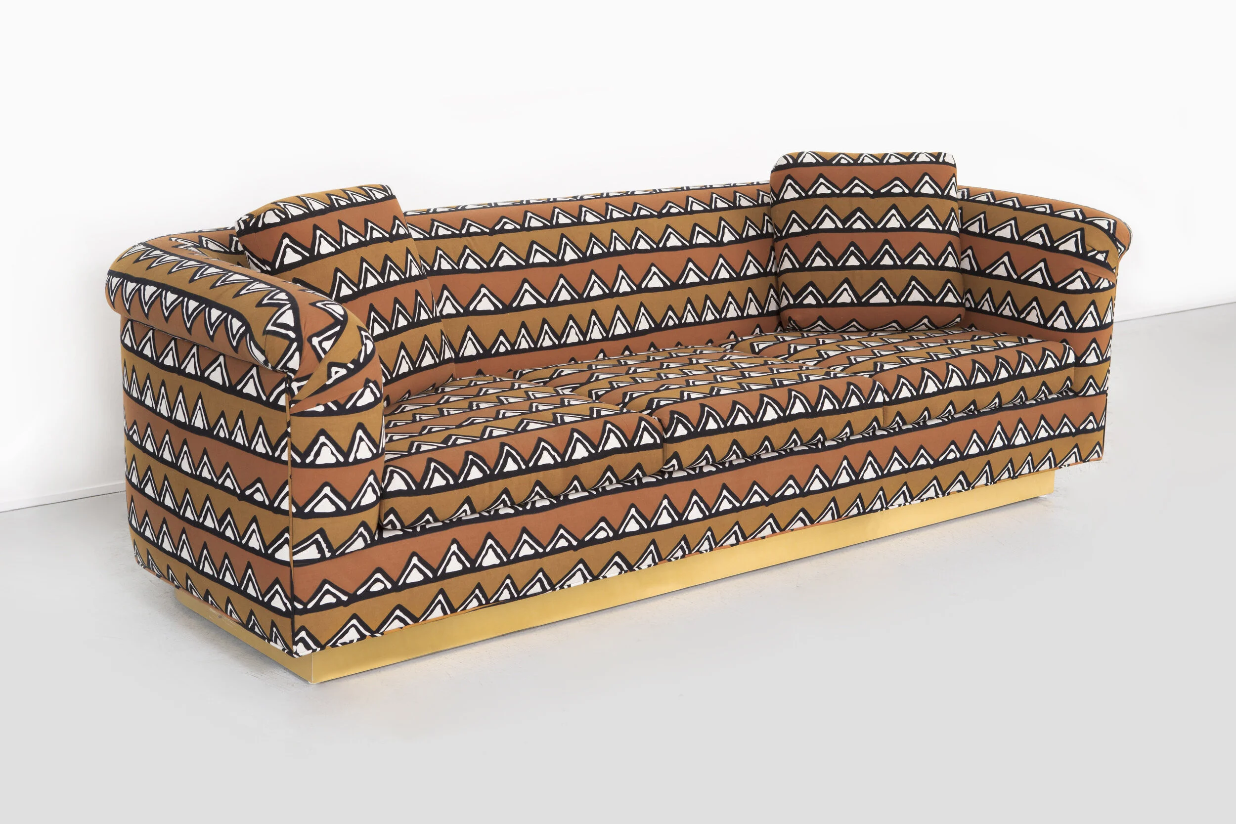 ROUNDED BARREL BACK BRASS PLATFORM SOFA