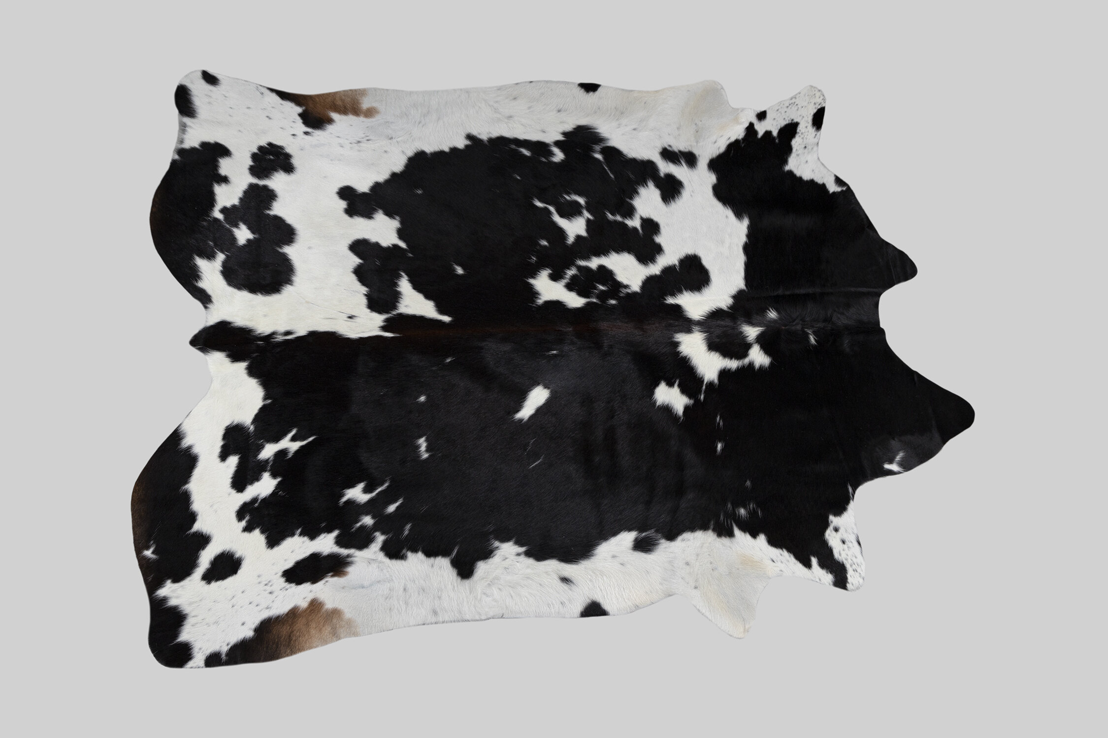 SPOTTED GENUINE BRAZILIAN COWHIDE