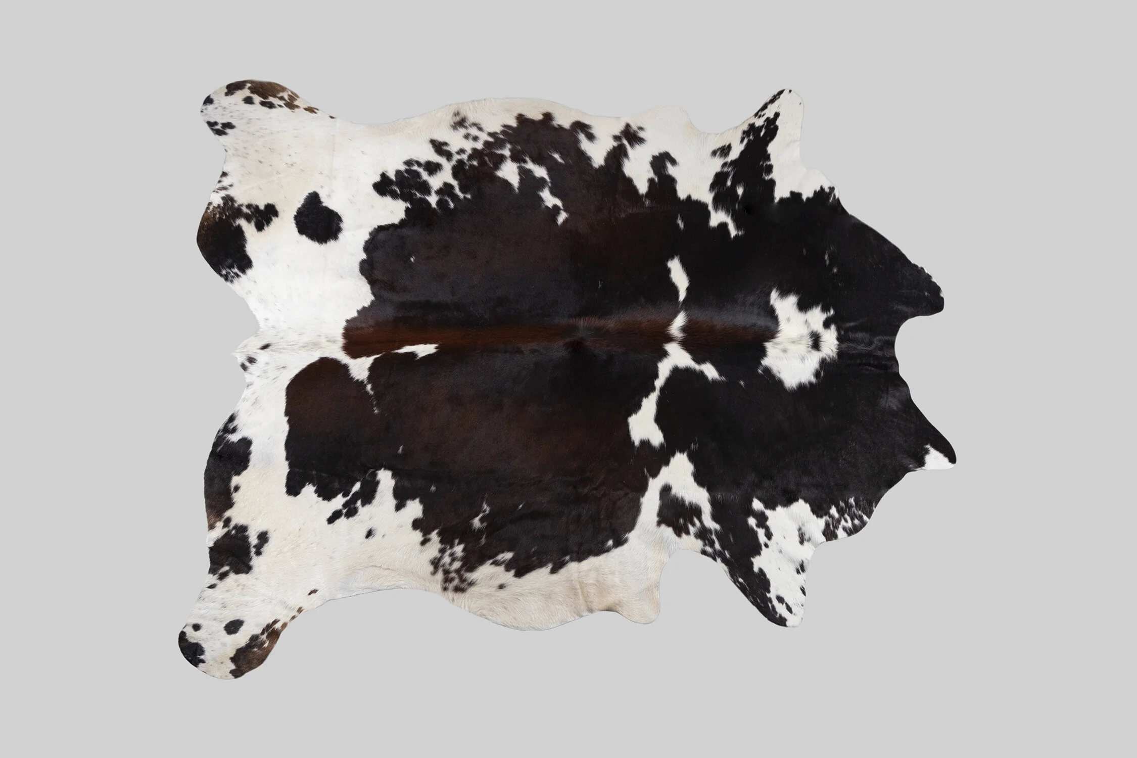 SPOTTED GENUINE BRAZILIAN COWHIDE