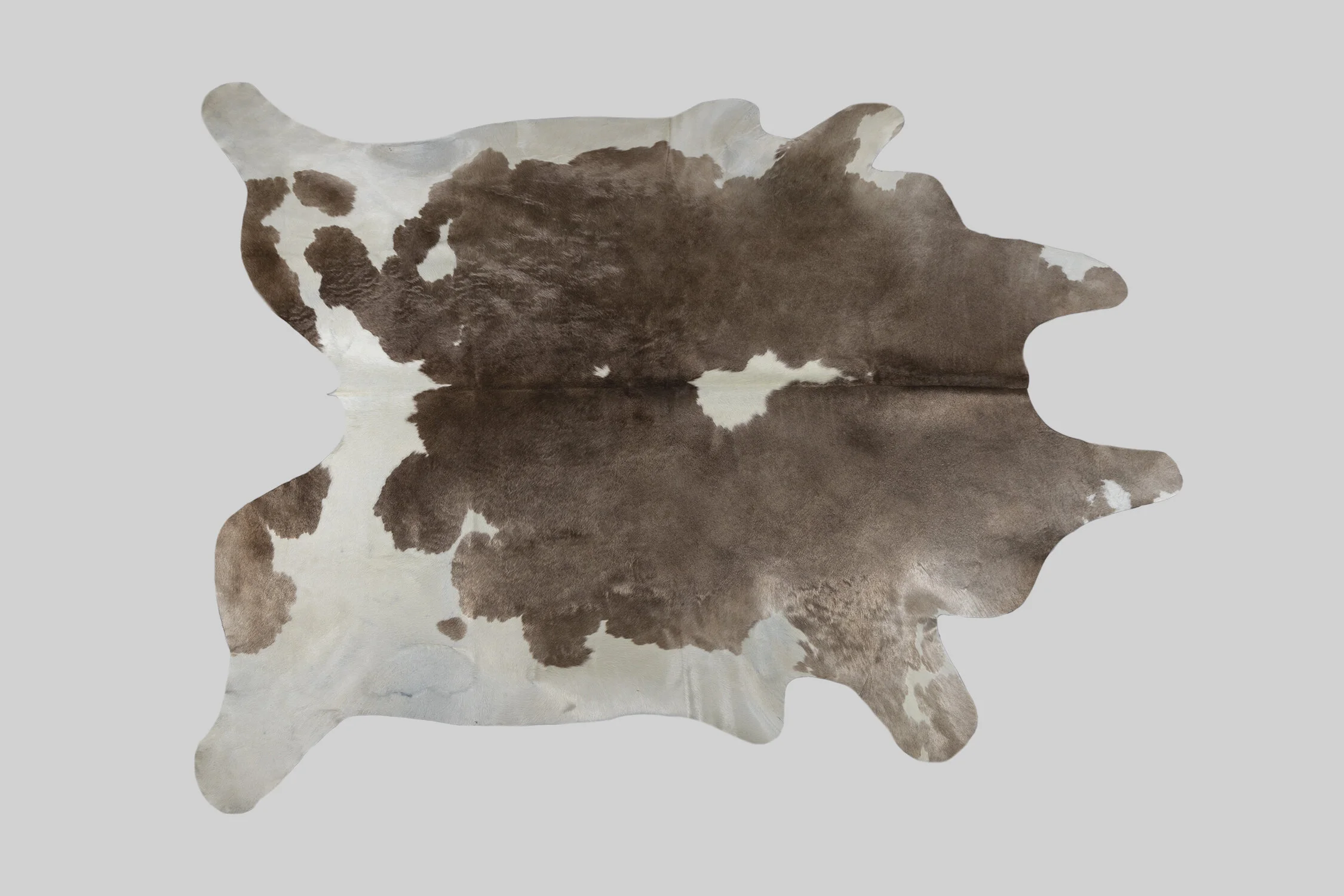 SPOTTED GENUINE BRAZILIAN COWHIDE