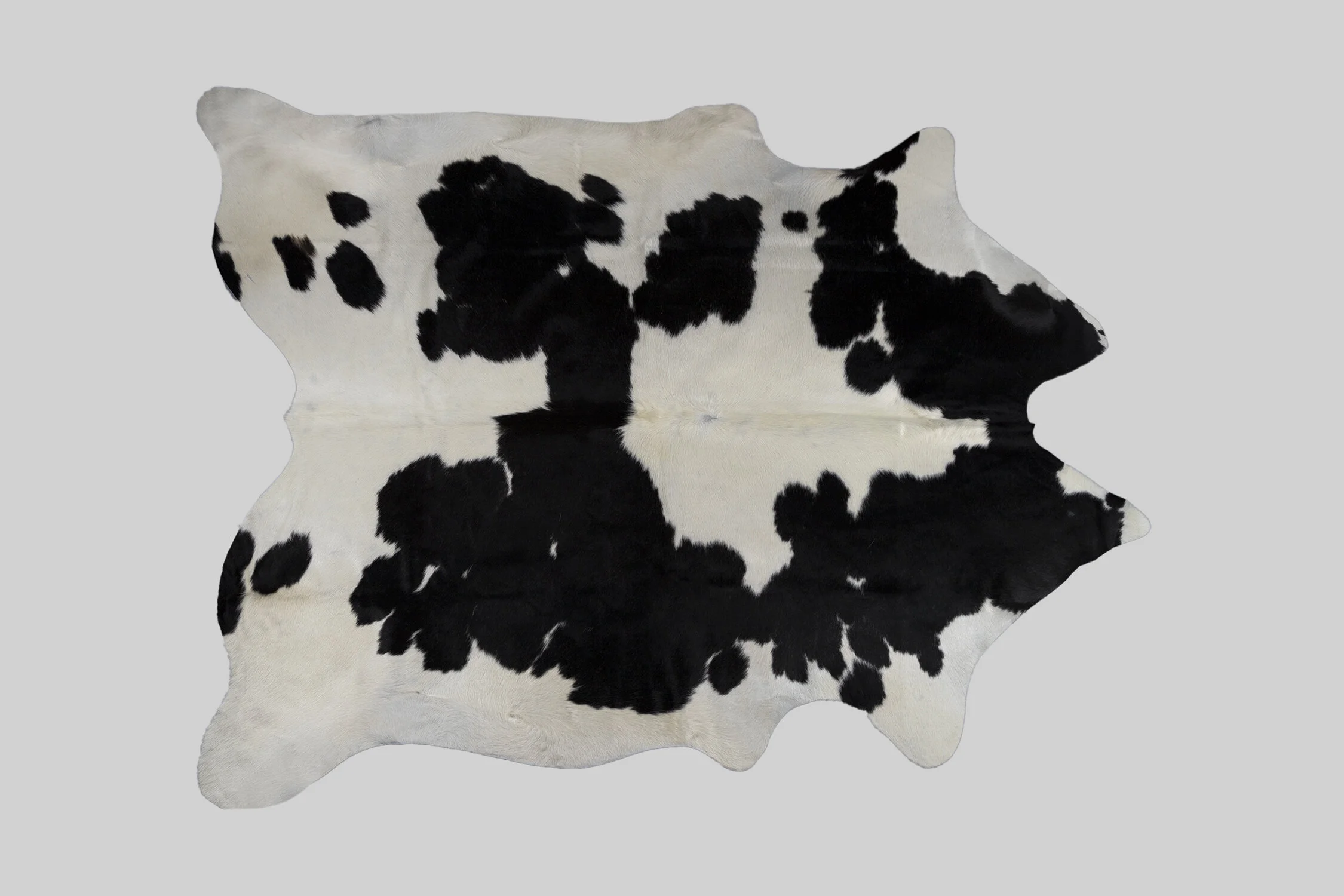 SPOTTED GENUINE BRAZILIAN COWHIDE