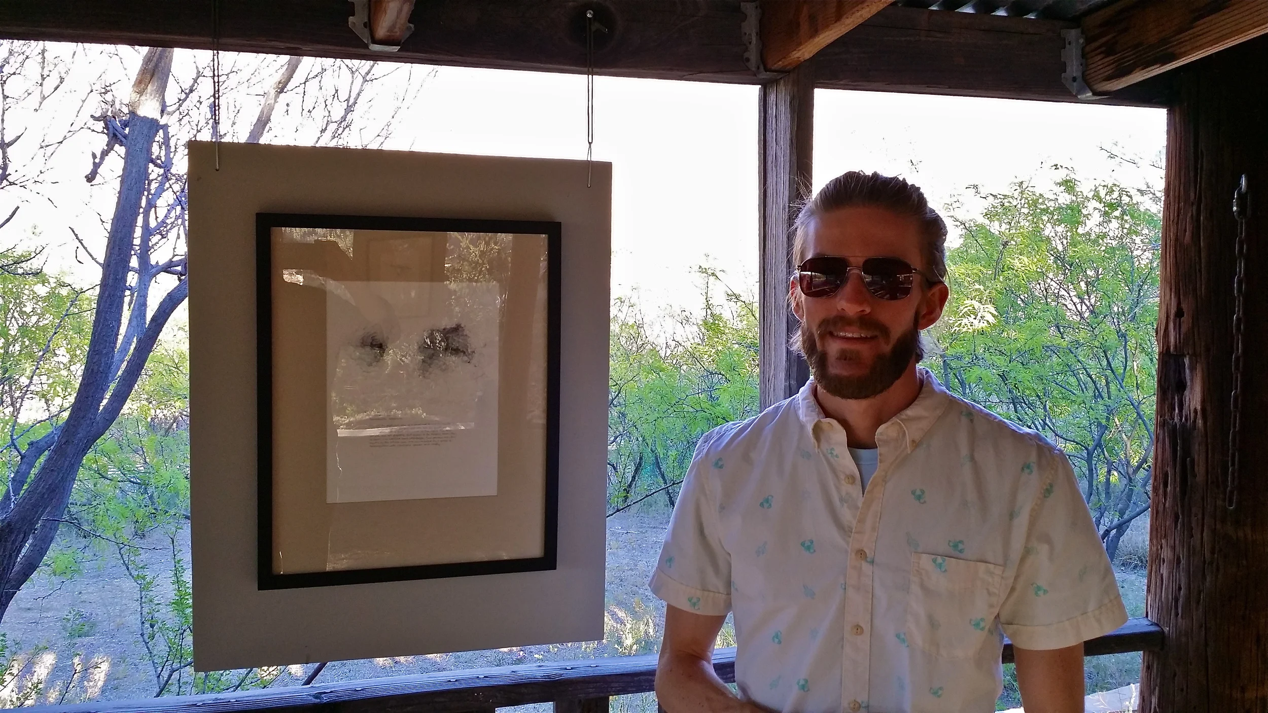 Bobby with one of his drawings.
