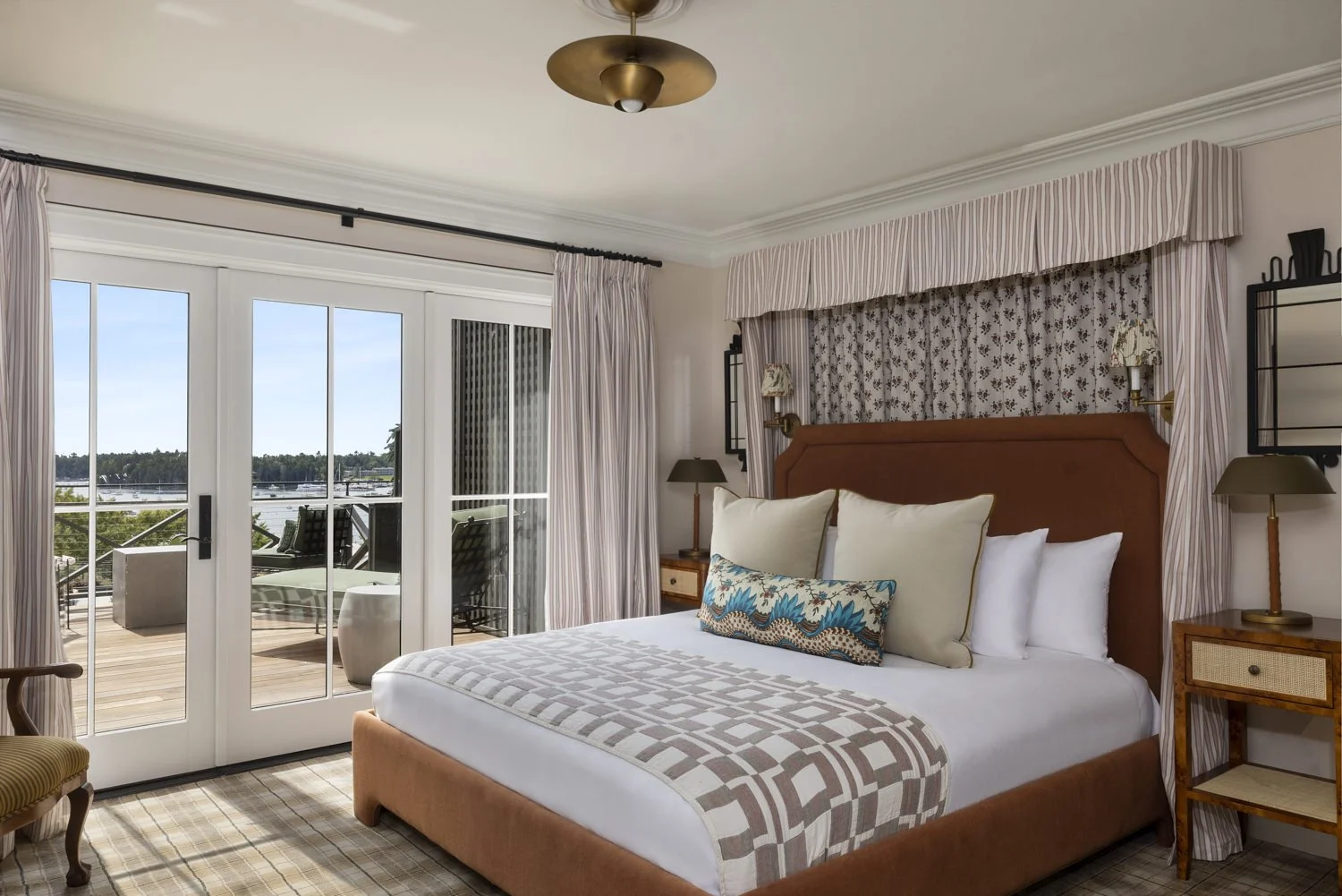 Hotel guest room with harbor views at The Asticou Hotel in Northeast Harbor, Maine, photographed by Heidi Kirn Photography for hospitality, hotel, resort, and interior marketing near Acadia National Park.