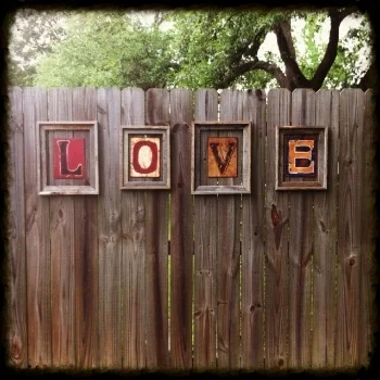 how to hang stuff on a wood fence.jpg
