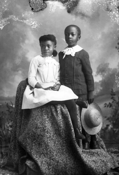 "Seated Girl and Boy Holding Hat" photographed by Alvan S. Harper circa 1890. From State Library & Archives of Florida
