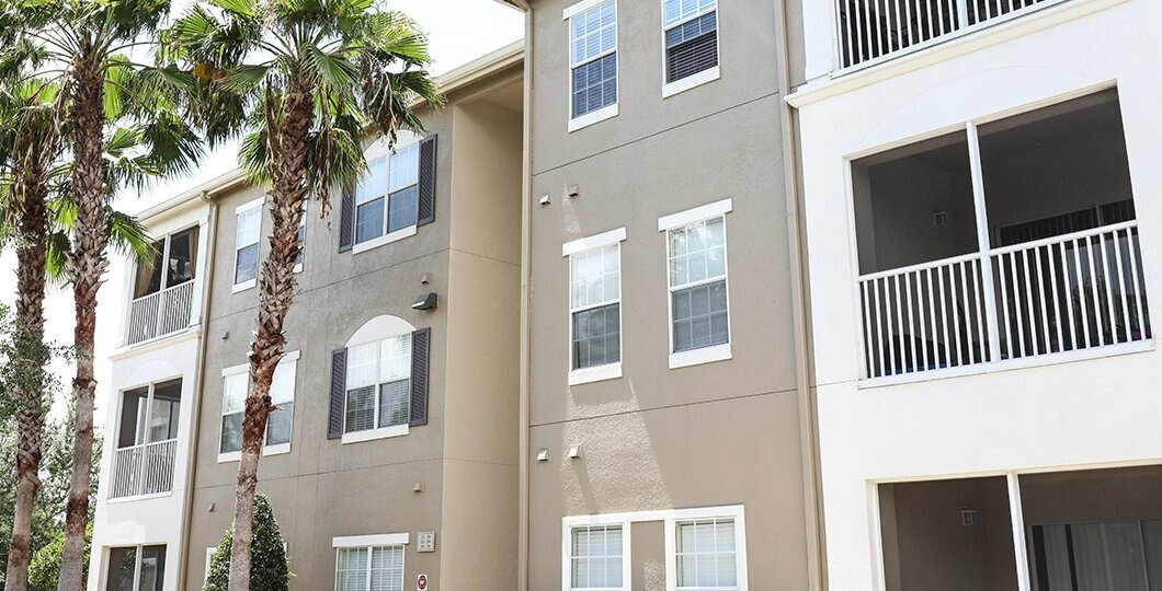 tan and white apartment building