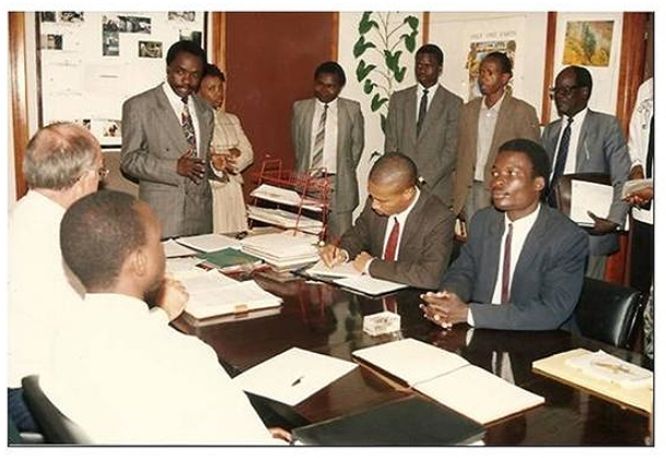 GIDE's PhD and Masters Program, 1994: Dr. Alfred Latigo, Executive Director &amp; Chair of the Academic Panel&nbsp;(standing)&nbsp;introducing &nbsp;students to Prof. Paul Muller (Late), Chairman Board of Directors&nbsp;(Seated, second on the left).