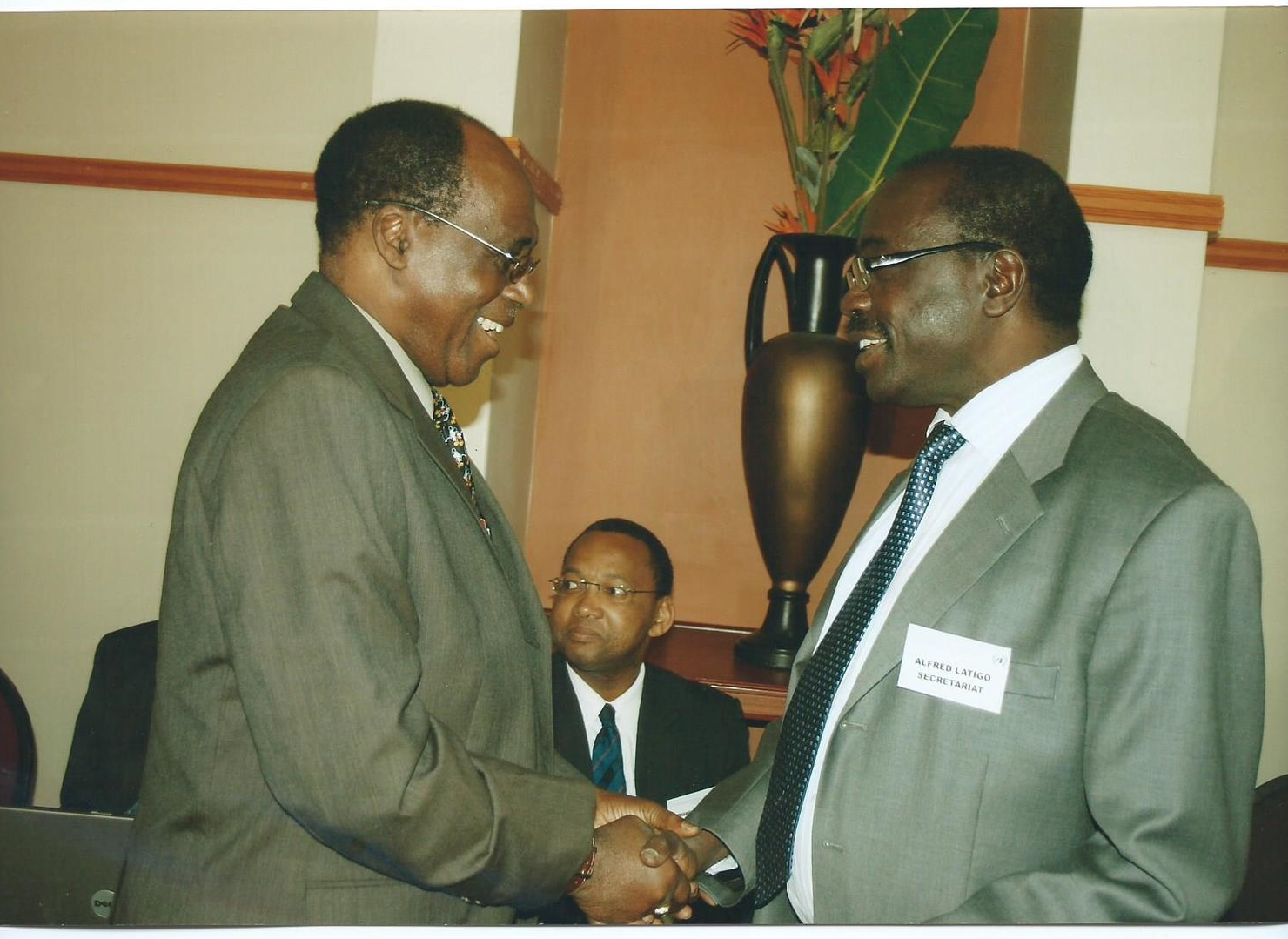 Prof. Ralph O Olaniyan, GIDE Board Director Chatting with Dr. Alfred Latigo at a Meeting in Johannesburg, South Africa, 2010. Prof. Olaniyan is the President of the R&G Economic Consultants LLC, USA a partner institution of GIDE.