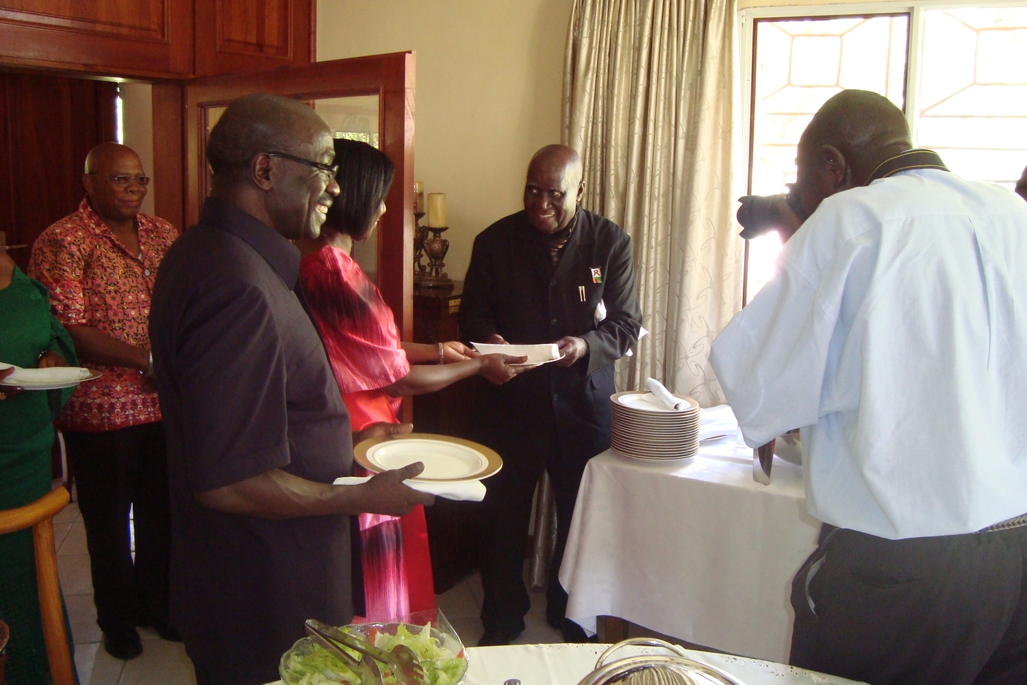 H.E. President Kenneth Kaunda (in "Kaunda Suit") with Alfred Latigo and Mrs. Latigo at a Luncheon after book launch. GIDE has an office for Southern Africa in Lusaka, Zambia. 