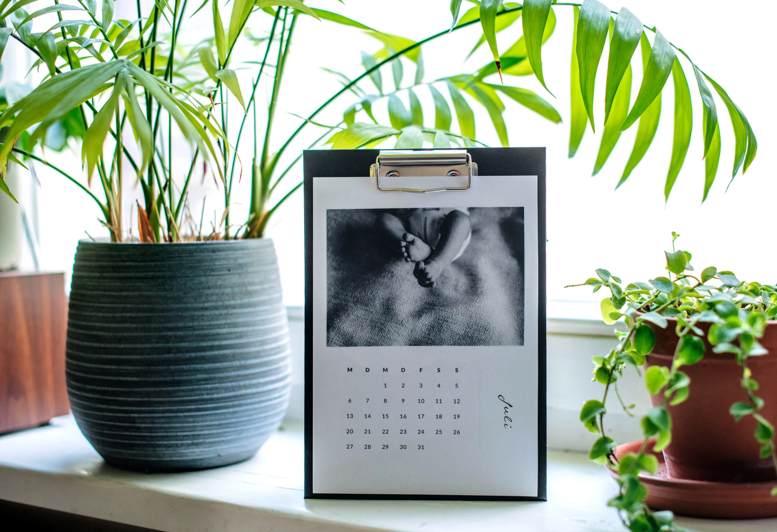 Fotokalender auf einem Klemmbrett im Format A5