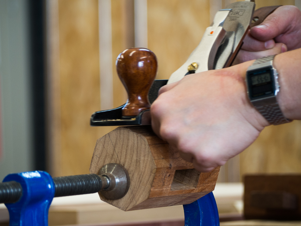 Vern carefully planing the facets of his mallet head stock, taking it to round. 