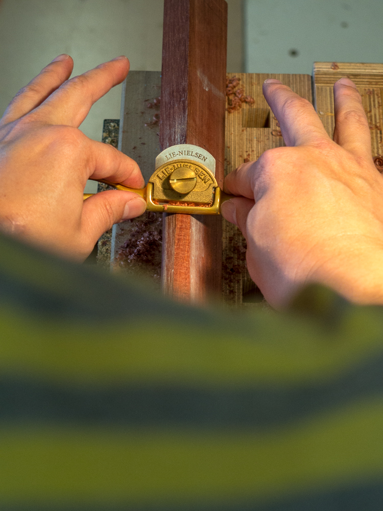 Vern using a spokeshave to shape the handle of his mallet.