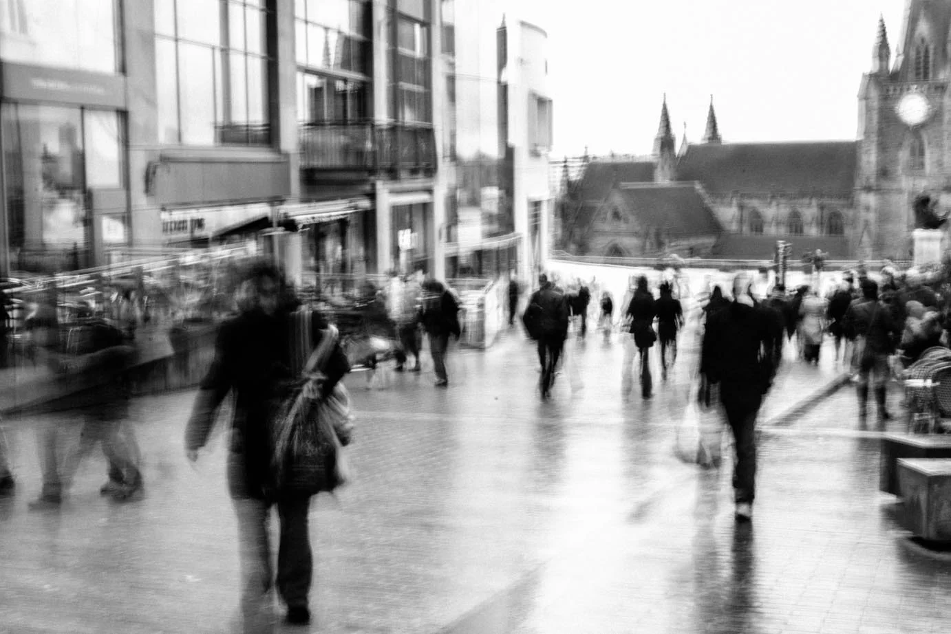 The reflections from the rain and the movement of the shoppers add to the atmosphere in this scene. Image copyright Katya Hall.