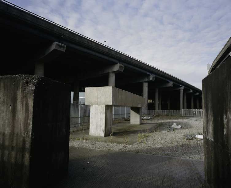 These obscure concrete henge like structures are dense concrete to supress the vibrations from the junction above.