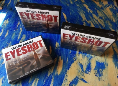 http://www.amazon.com/Eyeshot/dp/B00VVUAALM/ref=tmm_aud_swatch_0?_encoding=UTF8&sr=&qid = http://www.amazon.co.uk/Eyeshot-Taylor-Adams/dp/1494561565/ref=tmm_abk_title_0?ie=UTF8&qid=1408735736&sr=8-1 James and Elle Eversman are a young couple traveling through the Mojave desert on their way to a new life. When their car mysteriously breaks down, they are stranded in the middle of nowhere without much water and no cell phone reception. A mile away a deadly sniper has them in his crosshairs. They are pinned down behind their broken-down car, surrounded by open ground in all directions. There's nowhere to run and no one to help them. How can they possibly survive? With relentless tension, razor-sharp prose, and a surprising dose of dark humor, Eyeshot will keep you gripped until its stunning conclusion.
