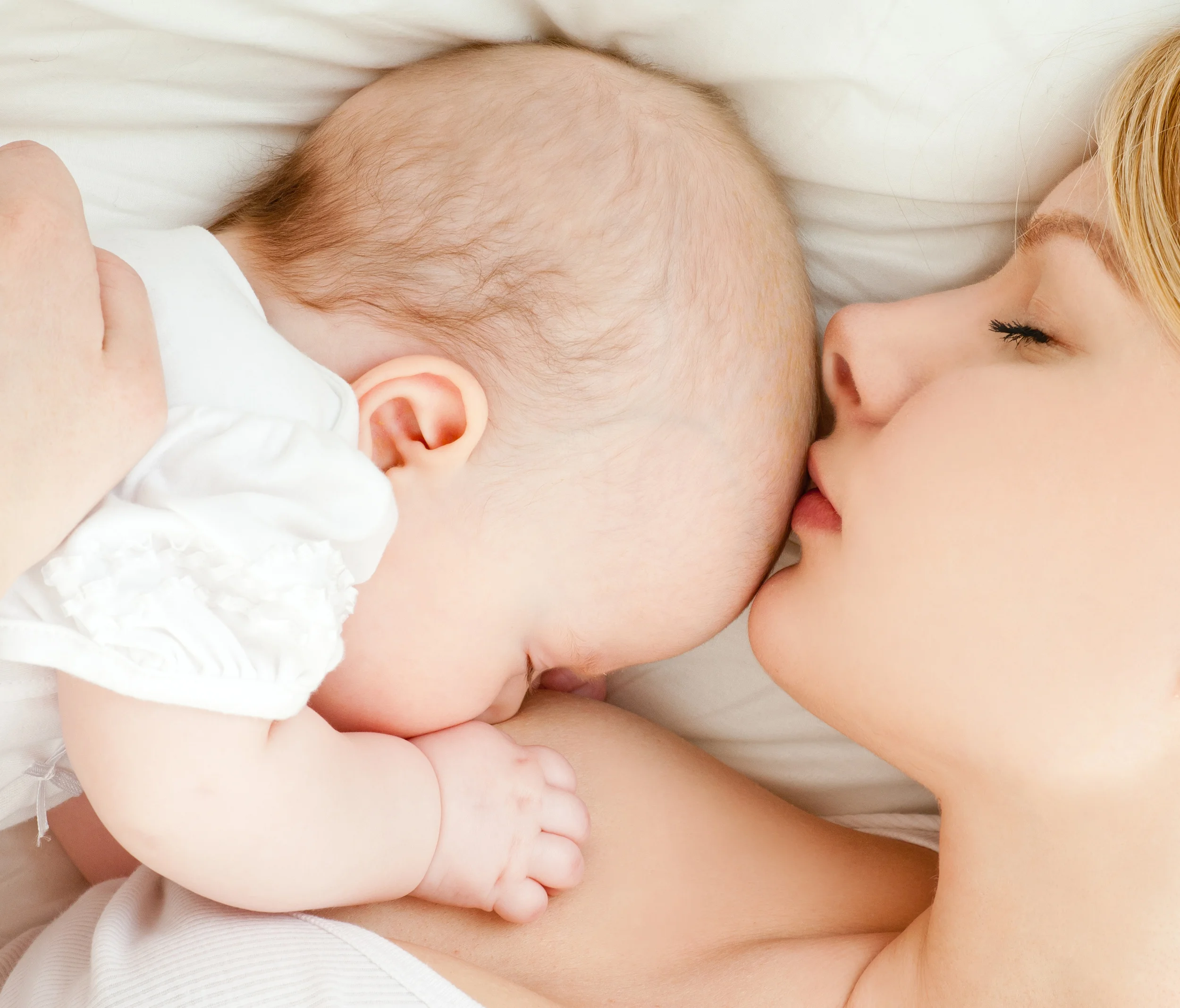 Mother breast feeding her infant