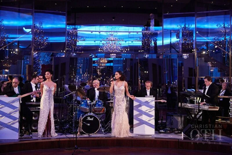 A 22-piece band (yes, you read that correctly) seamlessly segueing into dance tunes while eight pros twirled their partners, like magnets, pulling guests from dinner tables onto the revolving floor... 