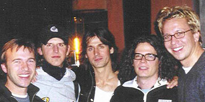   Grant (right) with Our Lady Peace band members  