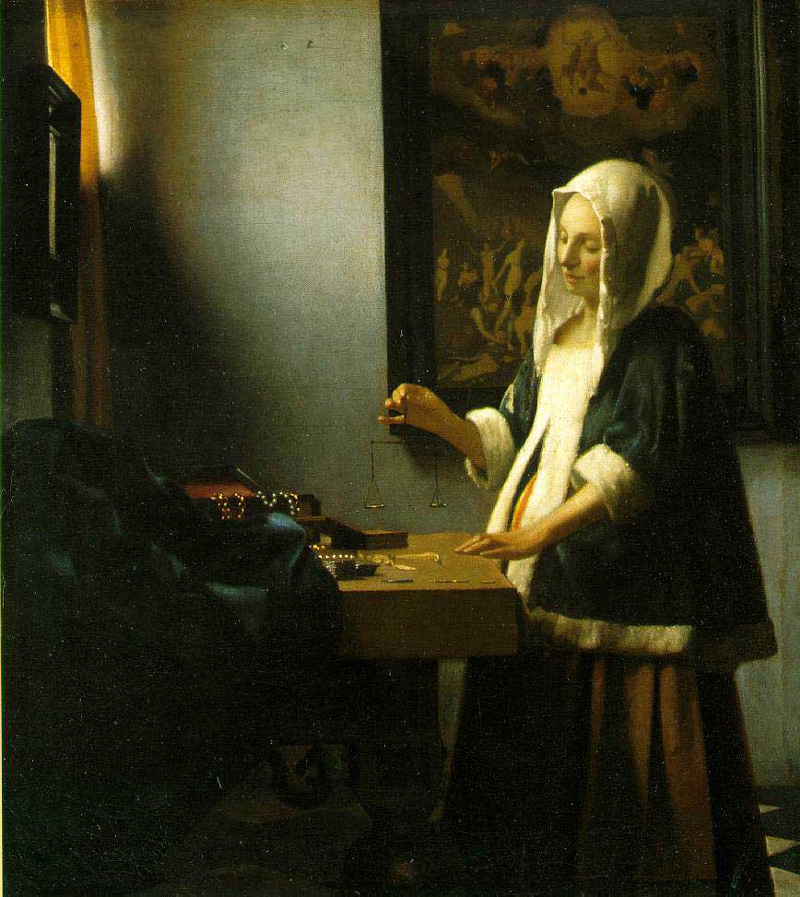 A Woman Holding a Balance by Johannes Vermeer