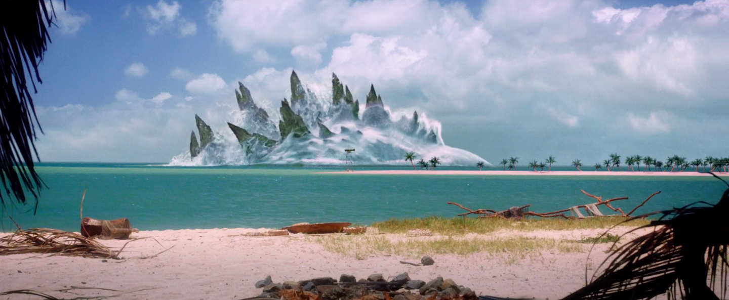 Godzilla se deja ver entre el agua.