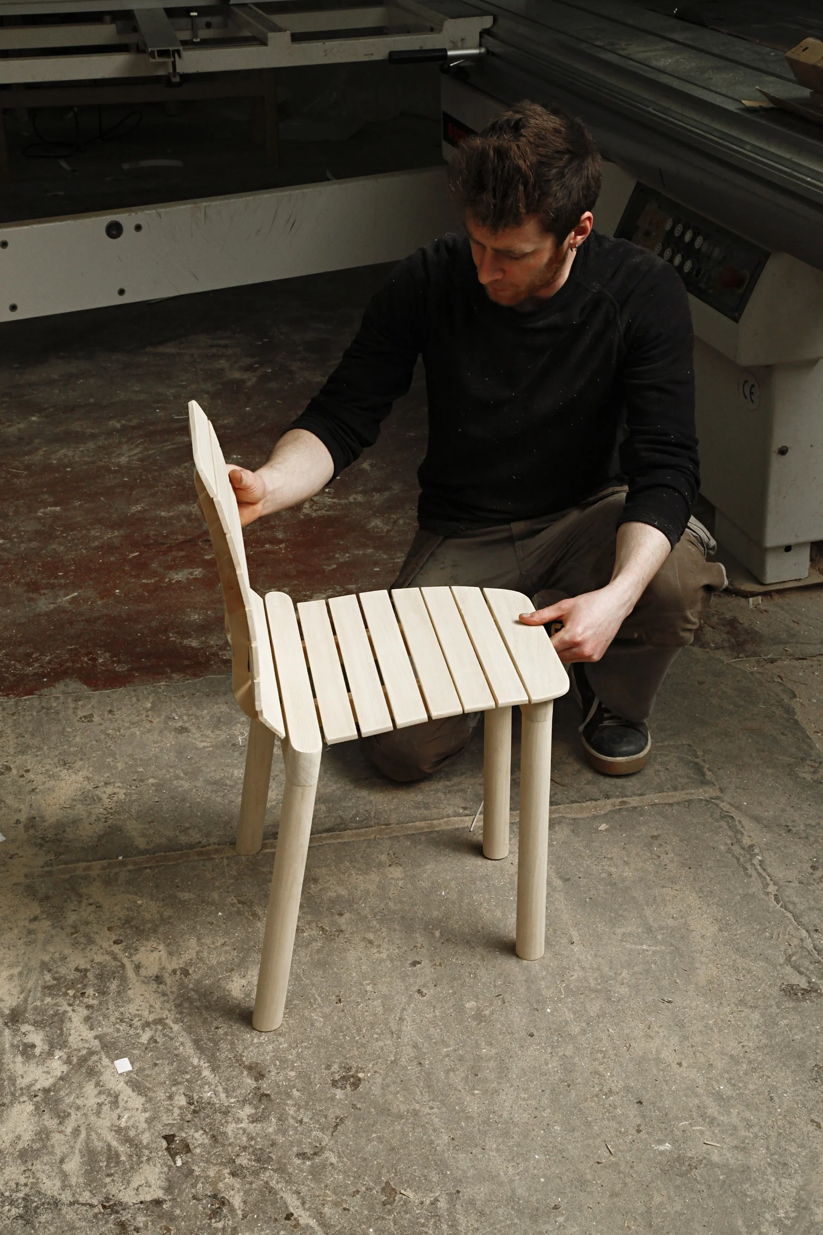 The chair has a light and transparent structure and draws the outline of a recognisable object for everyone. The cabinetmaker’s quality lies in assembling and finishing. By using slats fixed on a simple structure the overall make one single entity in maplewood. It is a picture of a bench in a single version that is stackable and reduced in its form.