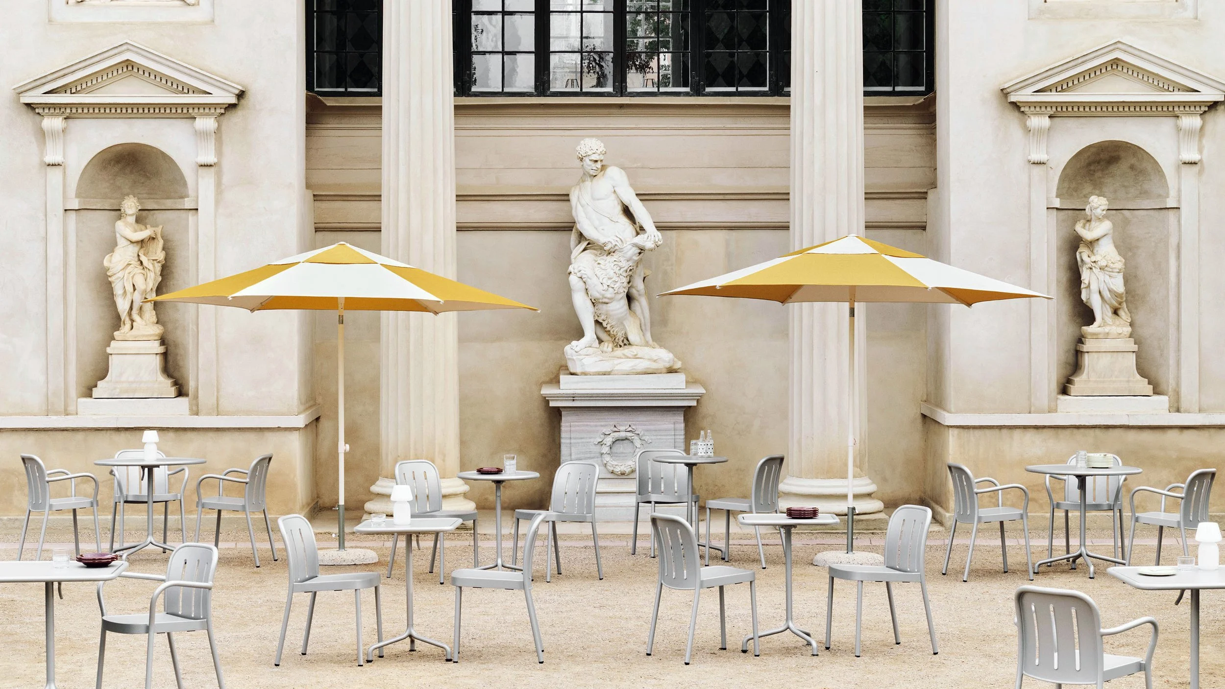  Defined by generous proportions and softly curved frames, the  Deville collection balances durability with an open, welcoming character - an invitation to sit, linger, and enjoy time outside. It includes stackable chairs, armchairs and tables in a v