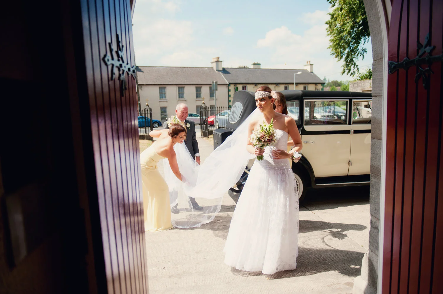 bride at church door bansha church tipperary Ireland Wedding Photography Irish wedding photographers
