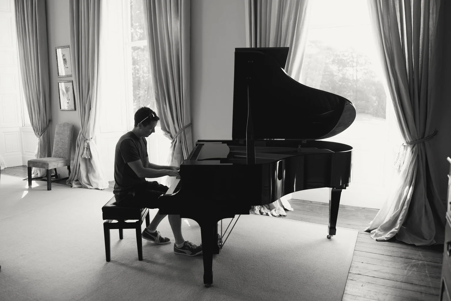 groom playing piano kilshane house tipperary Ireland Wedding Photography