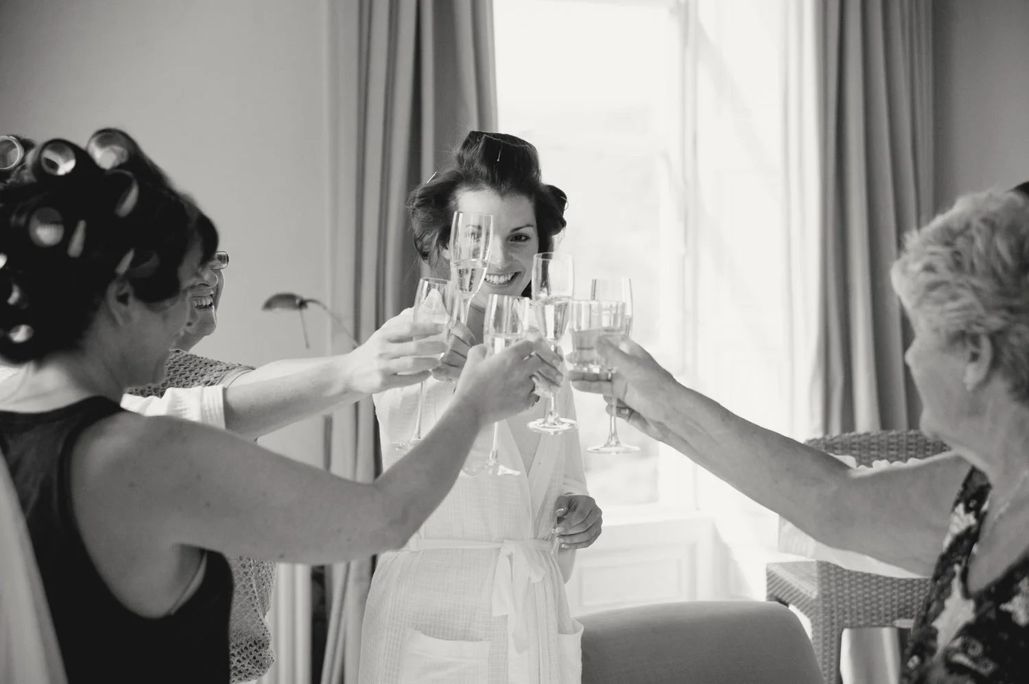 bride and bridesmaids raising glasses champagne kilshane house tipperary Ireland Wedding Photography