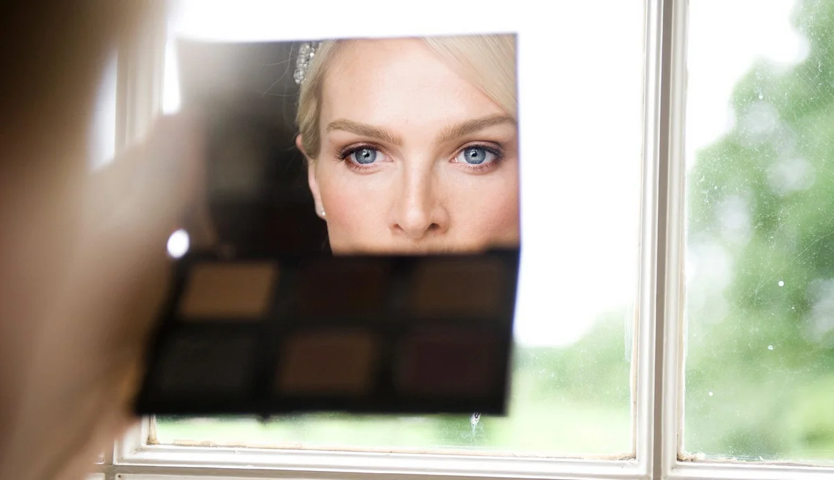 bride looking in handheld mirror tipperary ireland wedding photography
