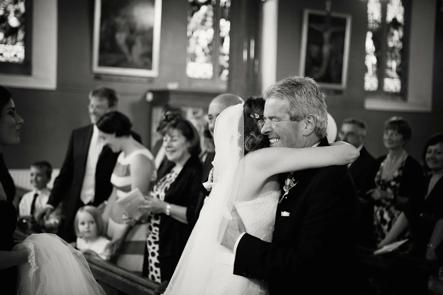 bride hugging father church dun laoghaire dublin Ireland Wedding Photography Irish wedding photographers